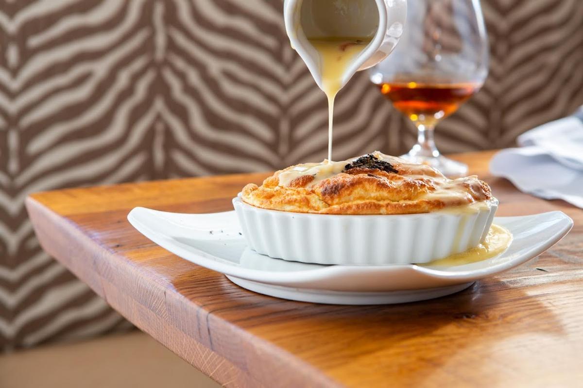 Souffle being poured over dessert